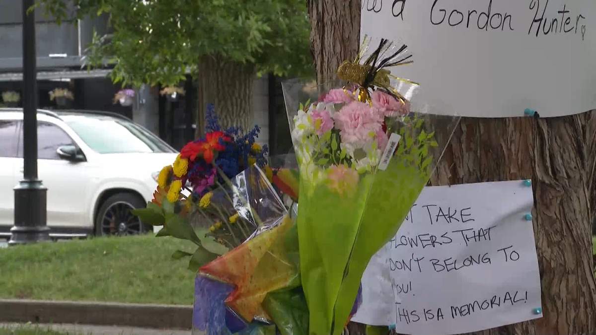 A photo showing some of the flowers and messages left by friends of 67-year-old Howard Gordon Hunter, who was the victim of a fatal weekend assault in Calgary's Tomkins Park.