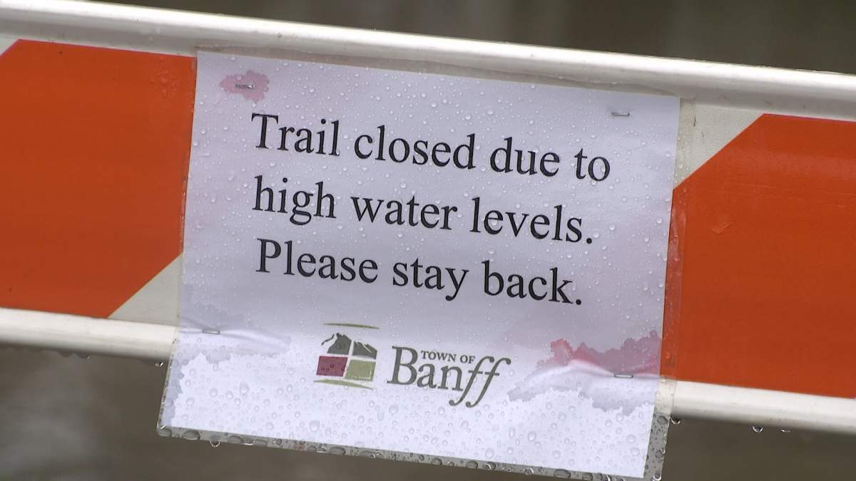 A sign in Banff notifying the closure of a trail.