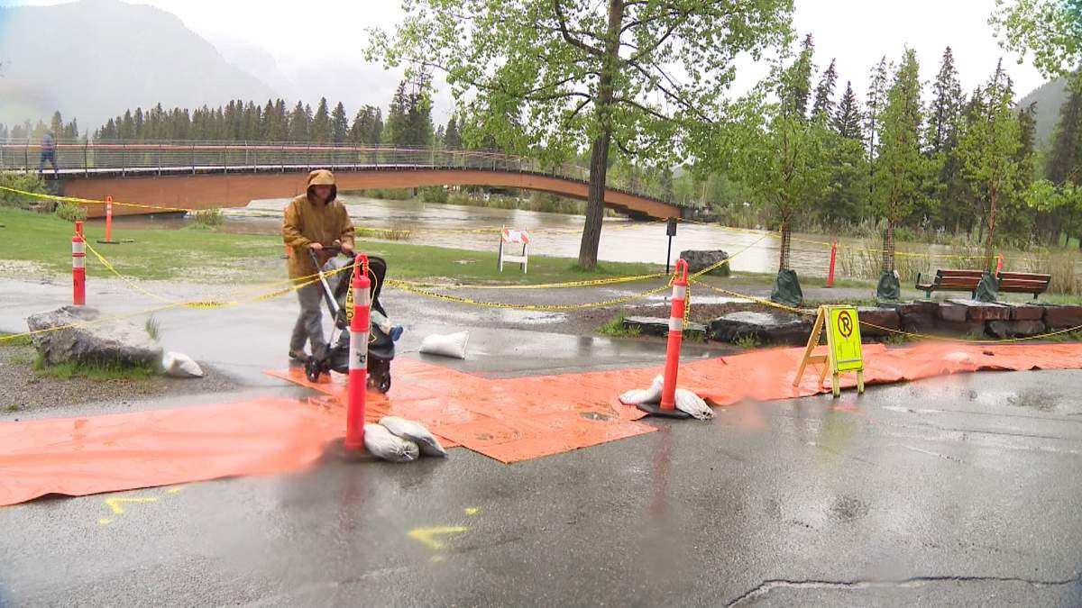 Flood prep begins along the Bow River in Banff.