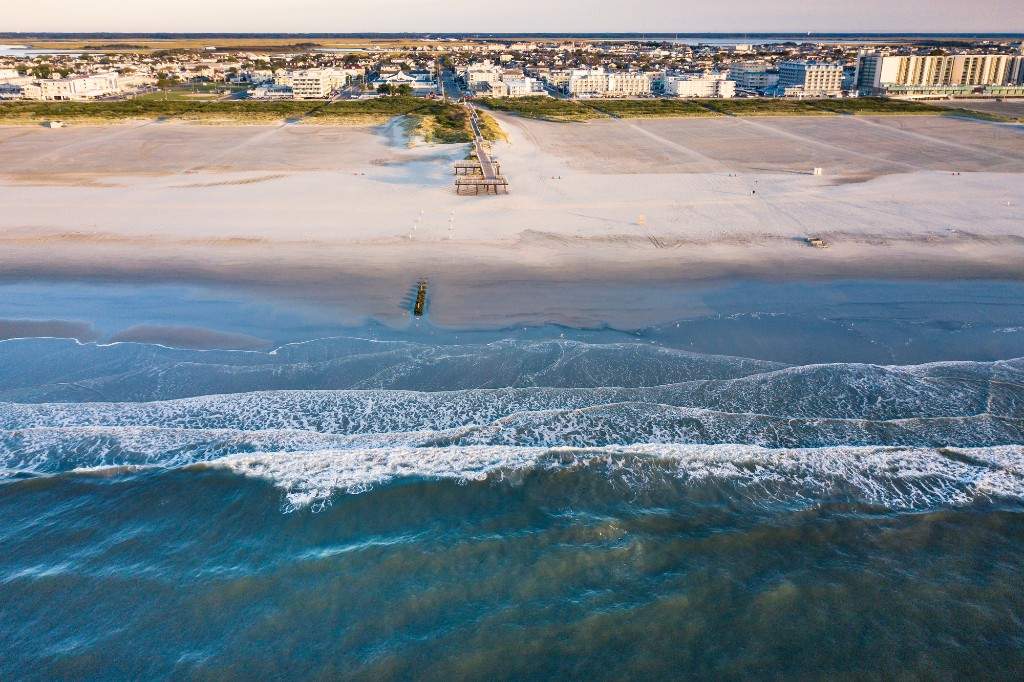 A file photo of an aerial view of Wildwood beach from the seaside splashing waves.