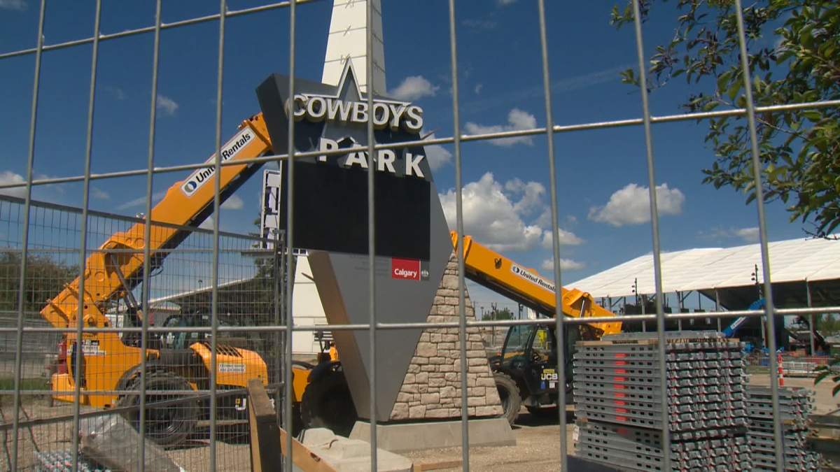 Work crews are seen setting up the venue for this year's Cowboys Music Festival at the west end of Calgary's downtown. Some nearby residents say the loud music from the festival makes living in the area unbearable during Stampede.