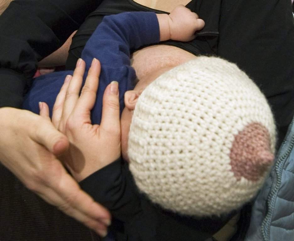 A woman nurses her baby in Montreal, on Wednesday, January 19, 2011. THE CANADIAN PRESS/Ryan Remiorz.