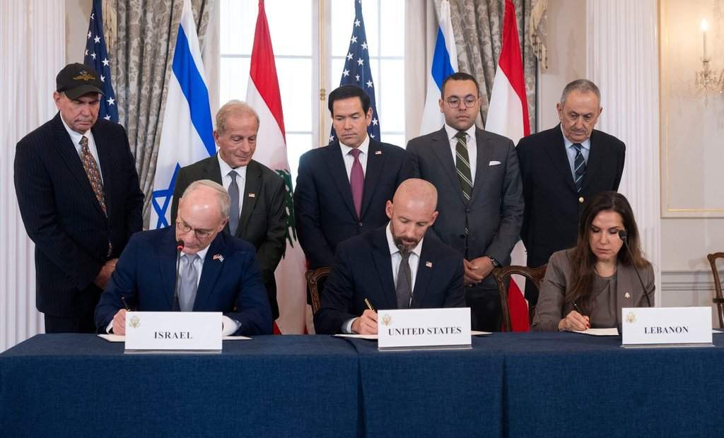 U.S. Secretary of State Marco Rubio and others watch, seated from left, Israel's Ambassador to the U.S. Yechiel Leiter, counselor Dan Holler, and Lebanon's Ambassador to the U.S. Nada Hamadeh, sign a framework agreement, described as a first step toward peace following months of conflict between Israel and the Lebanese militant group Hezbollah, at the State Department, Friday, June 26, 2026, in Washington. 