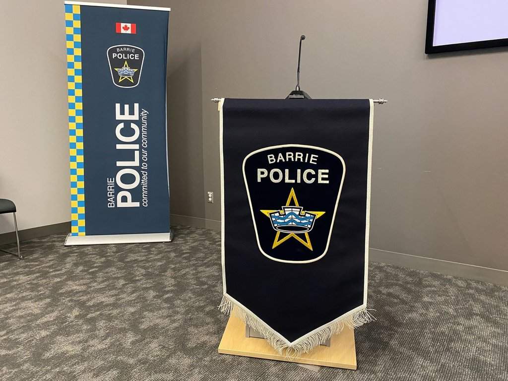 The Barrie Police Service logos are shown ahead of a press conference in Barrie, Ont., on Tuesday, Aug. 26, 2025. 