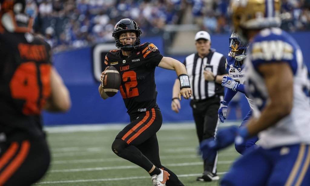 B.C. Lions quarterback Nathan Rourke (12) runs against the Winnipeg Blue Bombers during first-half CFL pre-season football action in Winnipeg on Friday, May 29, 2026. THE CANADIAN PRESS/John Woods.