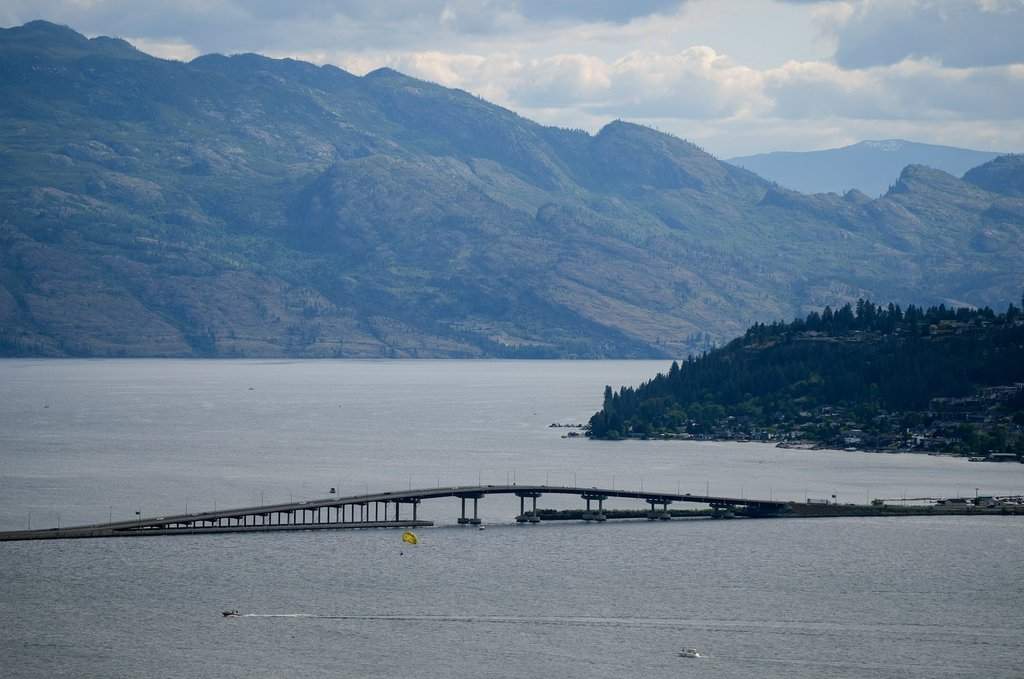 People parasail on Okanagan Lake as motorists travel over the William R. Bennett Bridge, in Kelowna, B.C., on Saturday, May 30, 2026. 