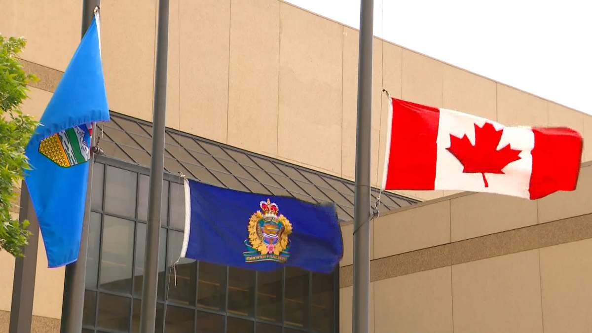 All flags outside Edmonton police headquarters have been lowered to half staff in honour of the two slain police officers from Ontario.