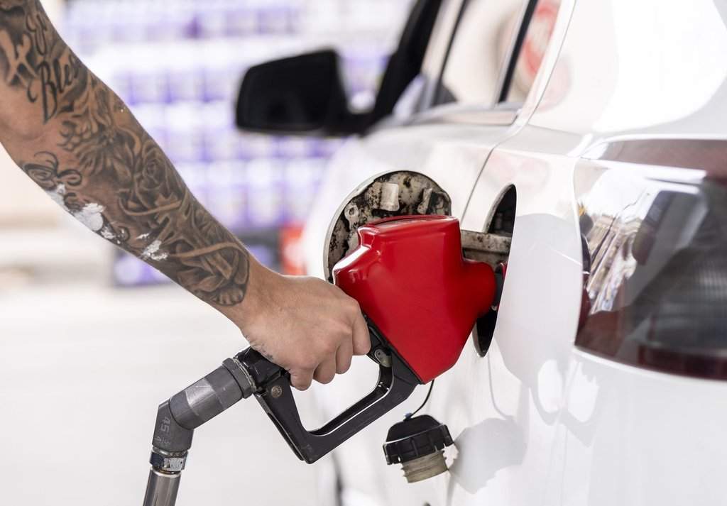 A person pumps gas in Montreal on Thursday, April 2, 2026. THE CANADIAN PRESS/Christinne Muschi.