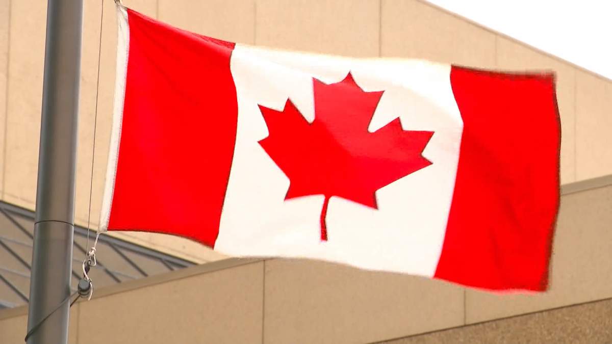 Flags outside both Calgary and Edmonton police headquarters have been lowered to half-mast to honour two police officers from Ontario who were slain in the line of duty this week.