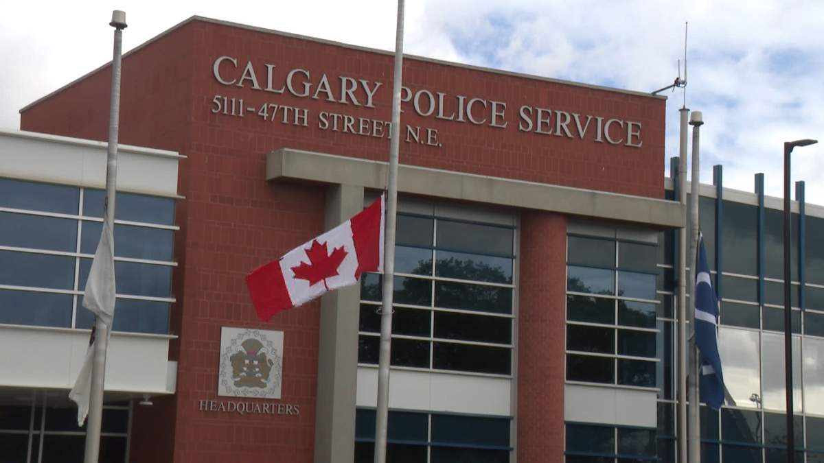 Flags outside Calgary police headquarters and detachments around the city have been lowered to half staff to honour the two police officers from Ontario who were slain in the line of duty this week.