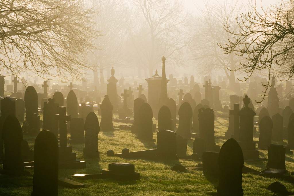 A file photo of a low winter sunlight flooding through a misty cemetery in Stoke-on-Trent.