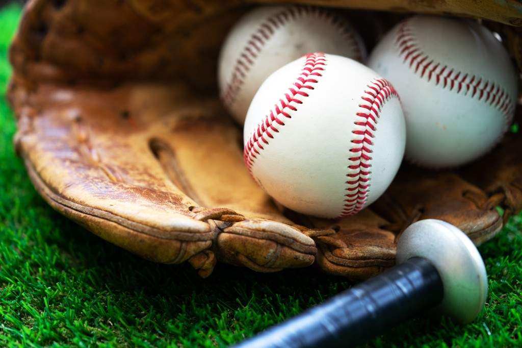 A file photo of an image of baseballs, a baseball glove and baseball bat.