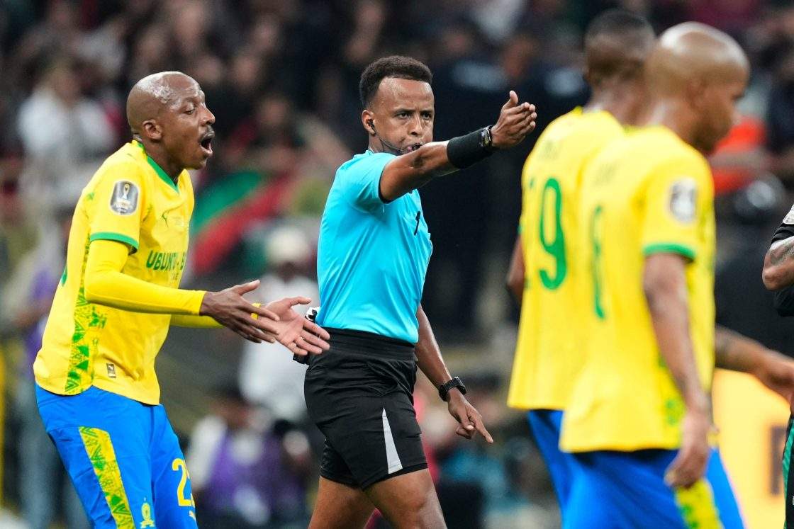 FILE - Referee Omar Artan, center, signals a penalty during the CAF Champions League final soccer match between AS FAR Rabat and Mamelodi Sundowns, in Rabat, Morocco, Sunday, May 24, 2026..