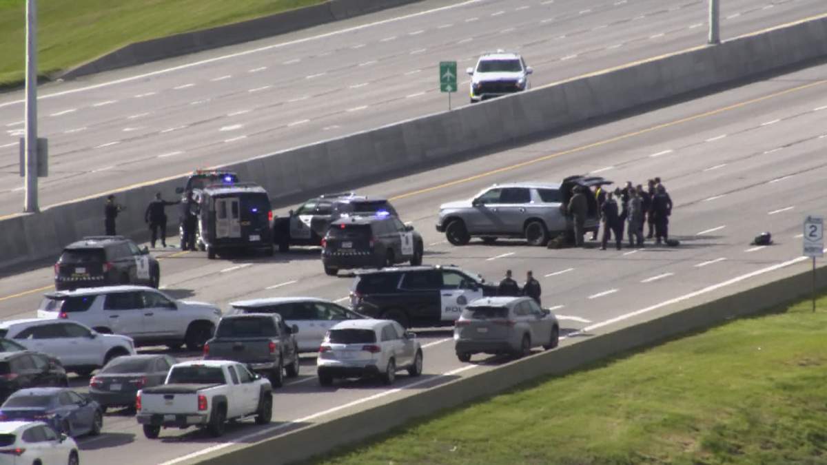 This image, taken from a traffic camera, shows police attempting to take the driver into custody during a traffic stop along Deerfoot Trail.
