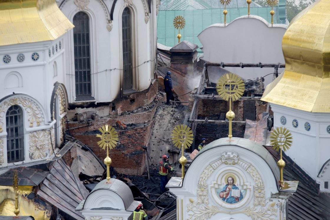 A firefighter works on the roof of the Dormition Cathedral at the Kyiv Pechersk Lavra that caught fire during a massive Russian combined attack, Kyiv, Ukraine, June 15, 2026.