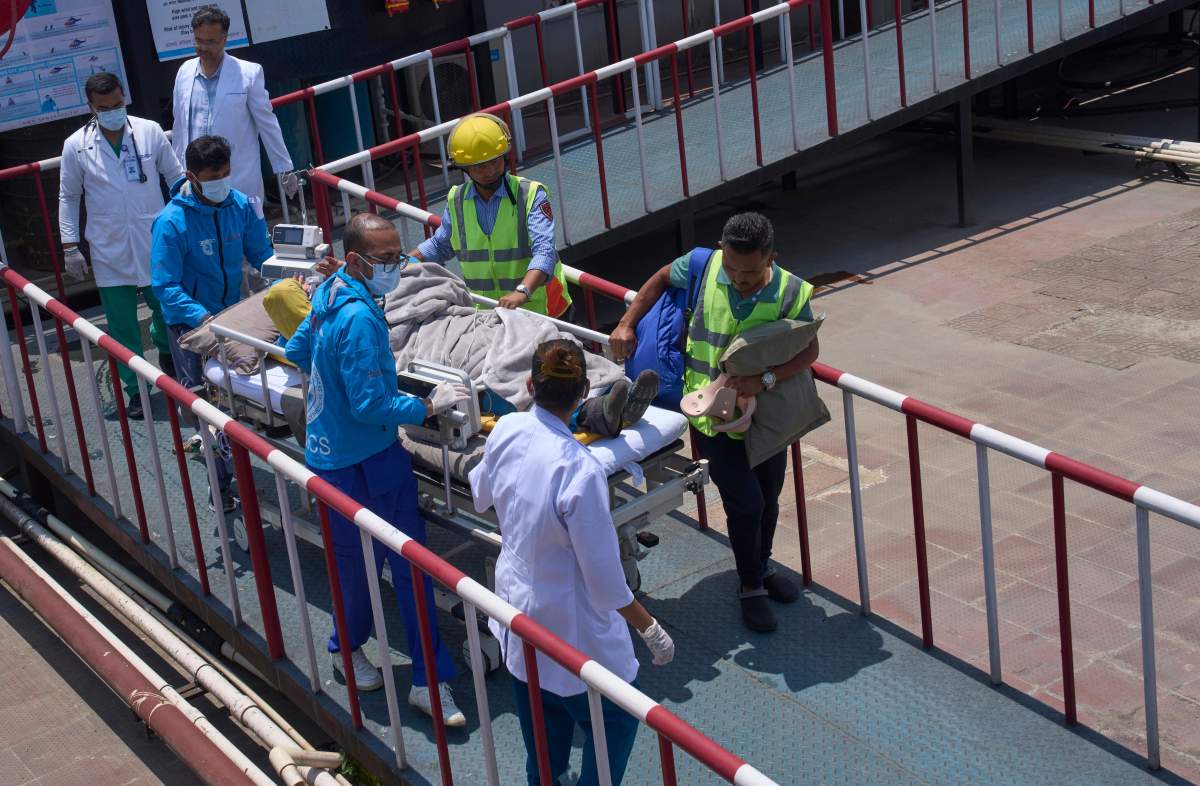 Medics treat Dawa Sherpa, a mountain guide who had been missing for several days in the Everest region, after he arrived at HAMS Hospital in Kathmandu, Nepal, on June 4, 2026.