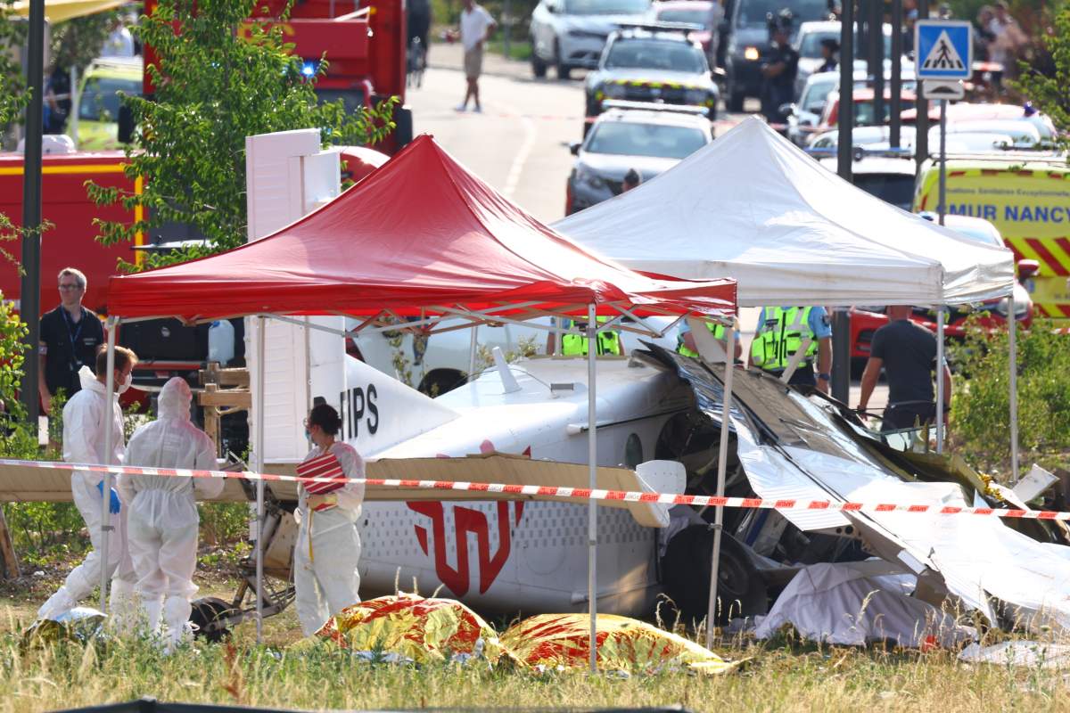 Forensic technicians examine a skydiving plane that crashed in Tomblaine northeastern France, killing all 11 people on board, Sunday, June 28, 2026. 