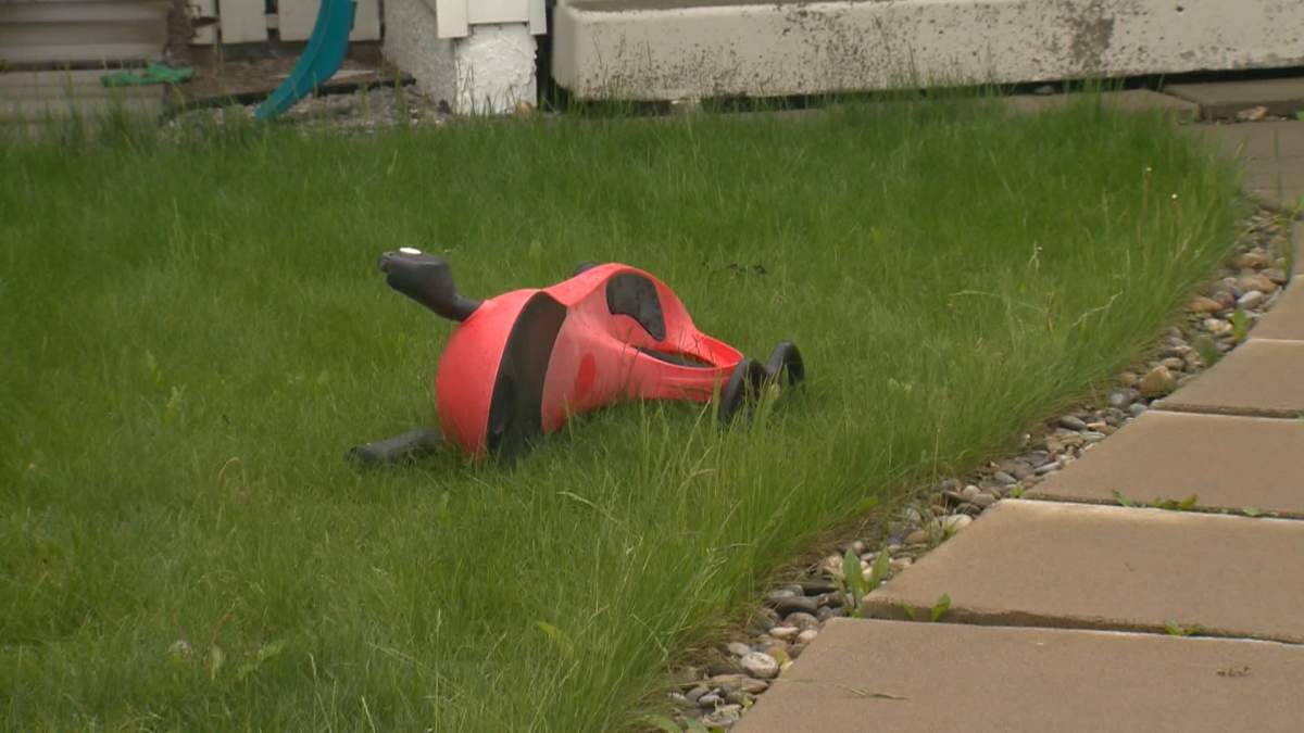 A day after the bodies were found, a child's toy was still lying on the front lawn of the house in Temple.