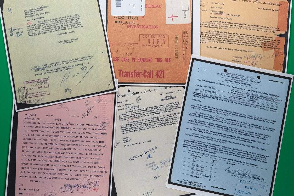 Files on UFOs, released Friday, May 8, 2026, by the Pentagon, are photographed in Washington.