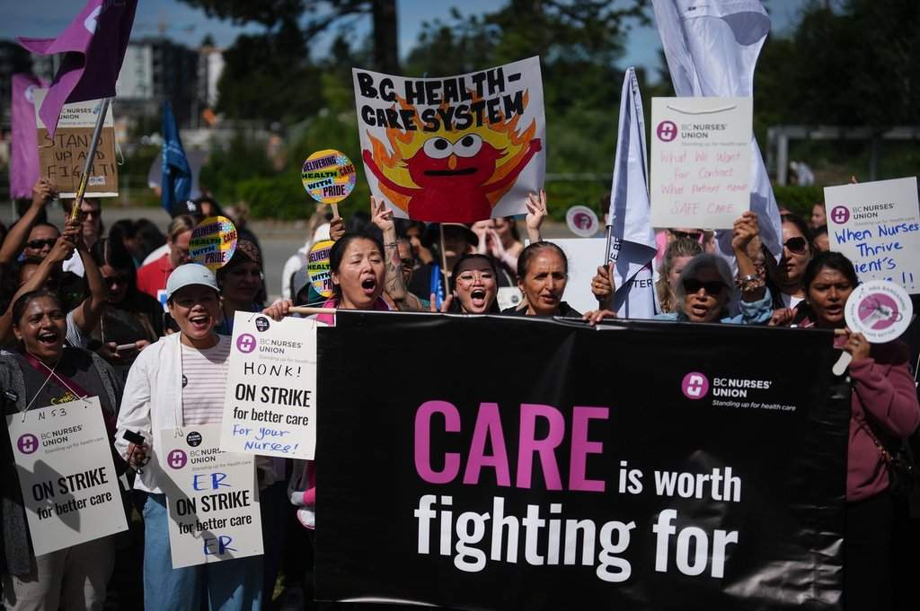 Members of the BC Nurses' Union picket outside Surrey Memorial Hospital, in Surrey, B.C., Thursday, July 9, 2026. THE CANADIAN PRESS/Darryl Dyck.