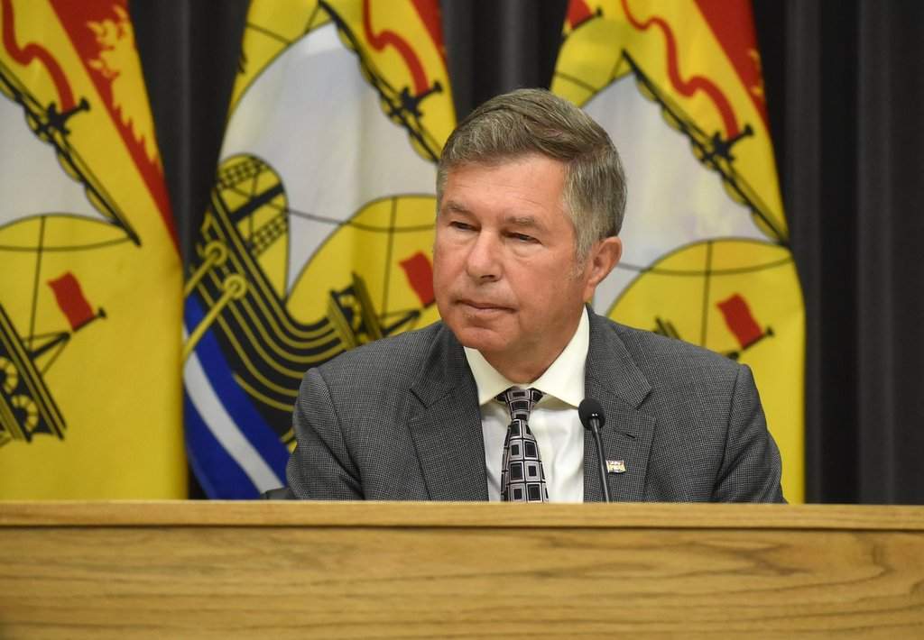 New Brunswick Health Minister Dr. John Dornan listens during a news conference in Fredericton on Wednesday April 29, 2026. THE CANADIAN PRESS/Eli Ridder.