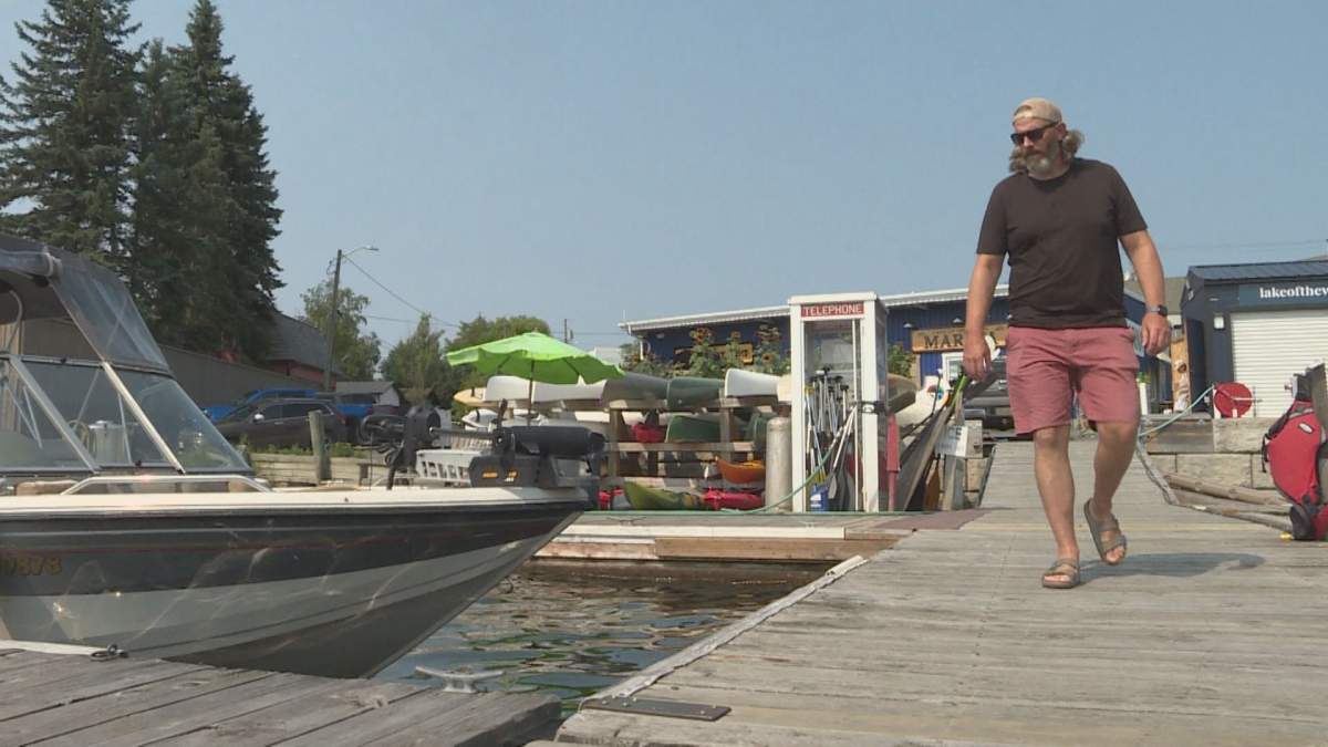 Chad English on dry land after completely his 110 kilometre swim across Lake of the Woods.