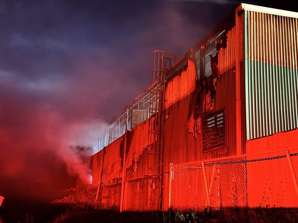 Fire damage is evident on the side of a waste and recycling transfer station in Clarence East, N.S., in this Thursday, July 30, 2026, handout photo. A spokesman for Valley Waste Resource Management in Kentville, N.S., says a damaged lithium-ion battery thrown out with regular garbage probably caused the fire. THE CANADIAN PRESS/Handout — Valley Waste Resource Management (Mandatory Credit).
