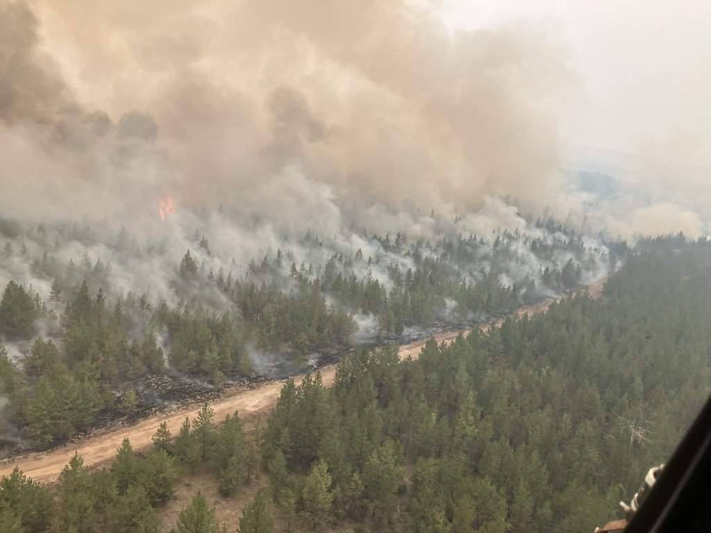 Firefighting crews conduct ignition operations in response to the Fiftynine Creek wildfire northwest of Clinton, B.C., in this handout photo, on Tuesday, July 21, 2026. THE CANADIAN PRESS/Handout — BC Wildfire Service (Mandatory Credit).