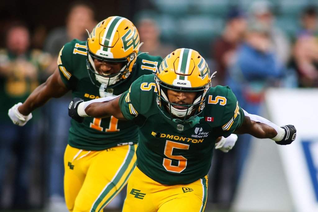 Edmonton Elks' Justin Rankin (5) and Kaion Julien-Grant (11) celebrate a touchdown against the Ottawa Redblacks during second half CFL football action in Edmonton on Thursday, July 9, 2026. THE CANADIAN PRESS/Codie McLachlan.