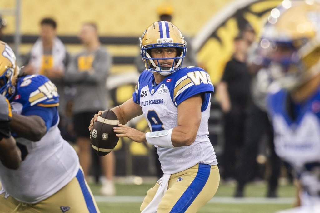Winnipeg Blue Bombers quarterback Zach Collaros (8) looks for a pass during first half CFL football action against the Hamilton Tiger-Cats, in Hamilton on Sunday, July 5, 2026. 