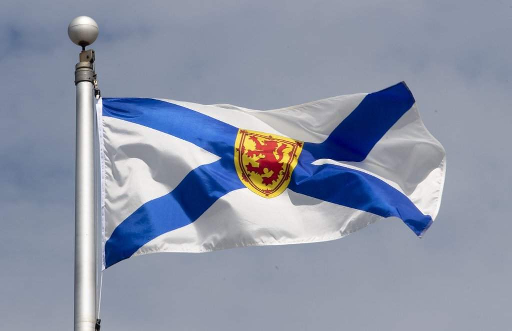 Nova Scotia's provincial flag flies on a flagpole in Ottawa on June 30, 2020. THE CANADIAN PRESS/Adrian Wyld.