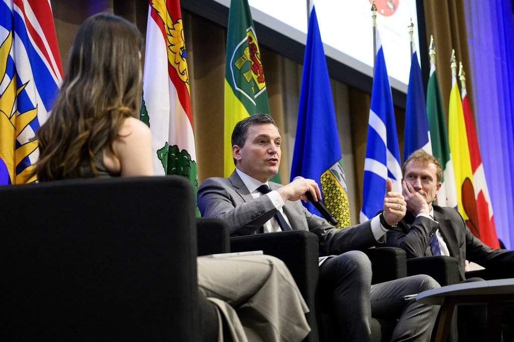 Evan Solomon, Minister of Artificial Intelligence and Digital Innovation and Minister responsible for the Federal Economic Development Agency for Southern Ontario, centre, speaks during a Gen(Z)AI Plenary Convening fireside chat, while Marc Miller, Minister of Canadian Identity and Culture, right, looks on, in Ottawa, on Thursday, April 30, 2026. 