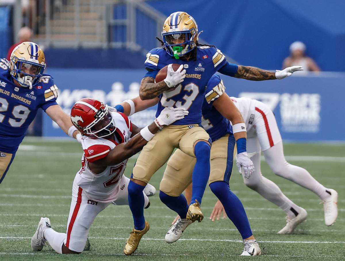 Winnipeg Blue Bombers' Trey Vaval (23) returns a punt against the Calgary Stampeders during first half CFL football action in Winnipeg on Friday, July 24, 2026. THE CANADIAN PRESS/John Woods.
