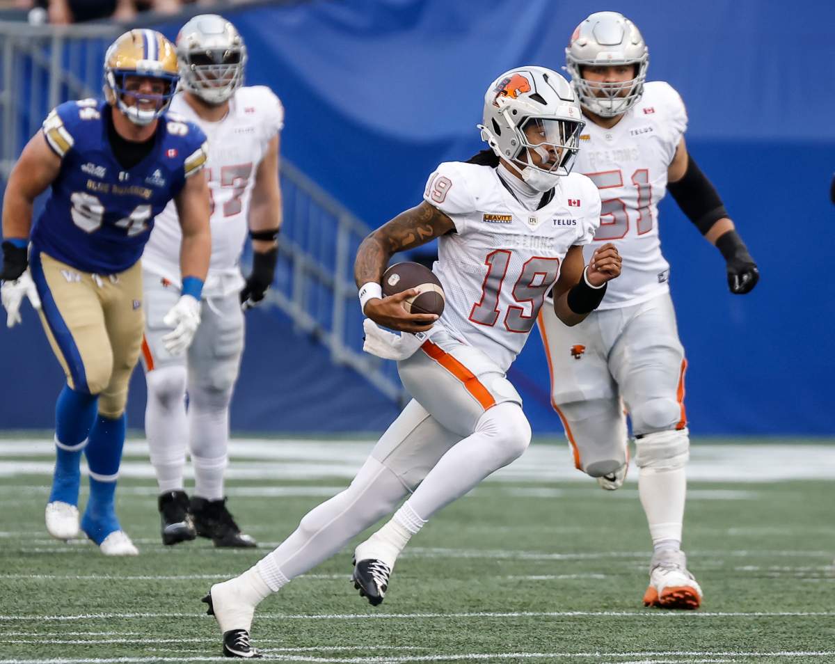 B.C. Lions quarterback Kaidon Salter (19) runs for the first down during first half CFL football action against the Winnipeg Blue Bombers in Winnipeg on Thursday, July 30, 2026. THE CANADIAN PRESS/John Woods.