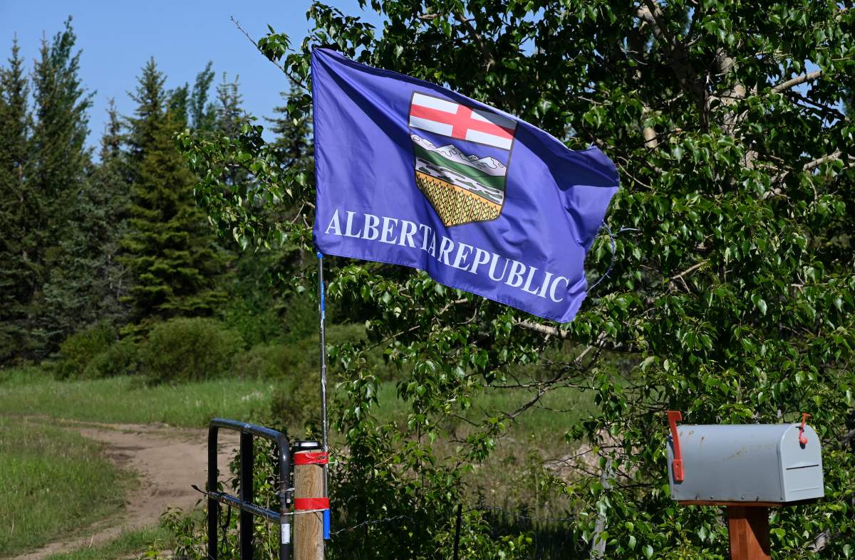 An Alberta provincial flag is pictured along Highway 20 near Breton, Alta., on June 19 2026. THE CANADIAN PRESS IMAGES/Don Denton