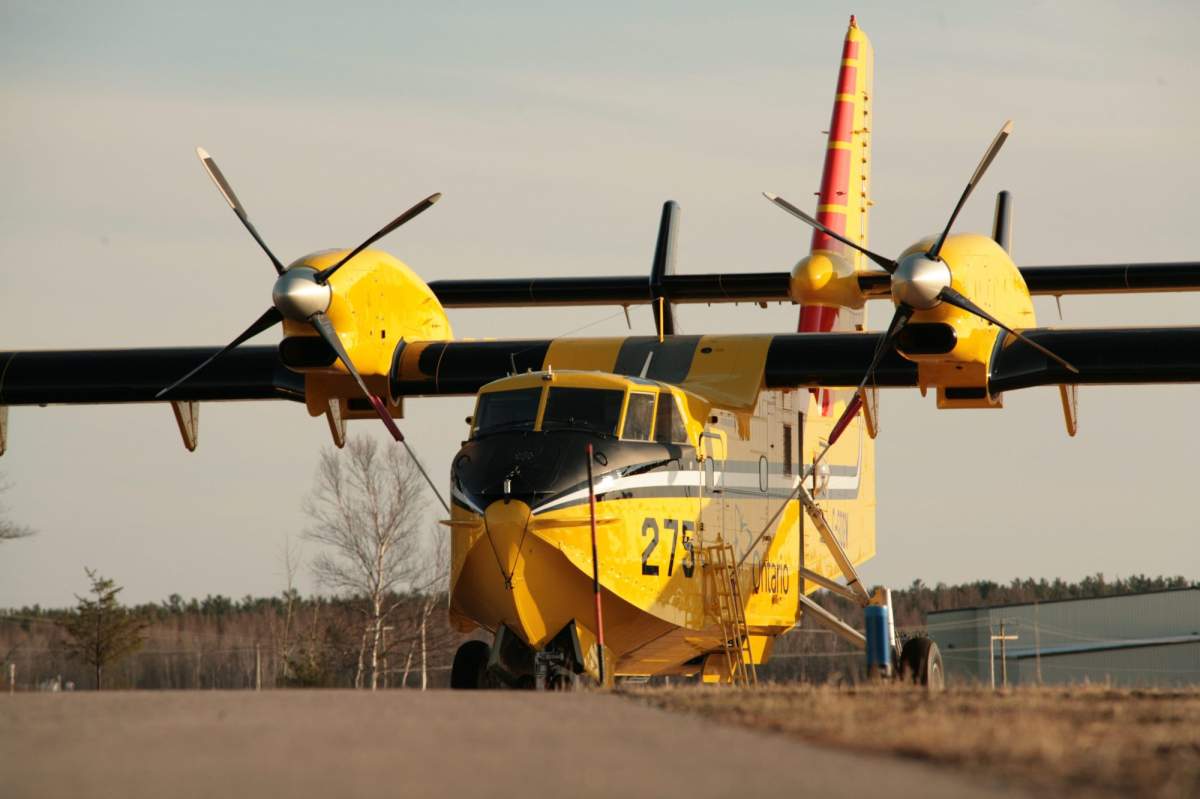 Ontario Ministry of Natural Resources Water Bomber CL-415 stands at the ready at the Sault Ste Marie Airport.
