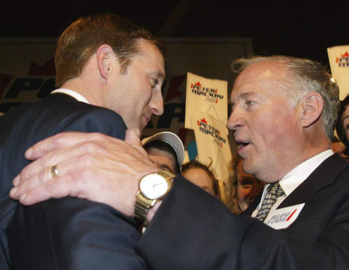 Progressive Conservative Party leader Peter MacKay (left) is congratulated by his father Elmer MacKay after winning the PC leadership convention in Toronto on May 31, 2003.