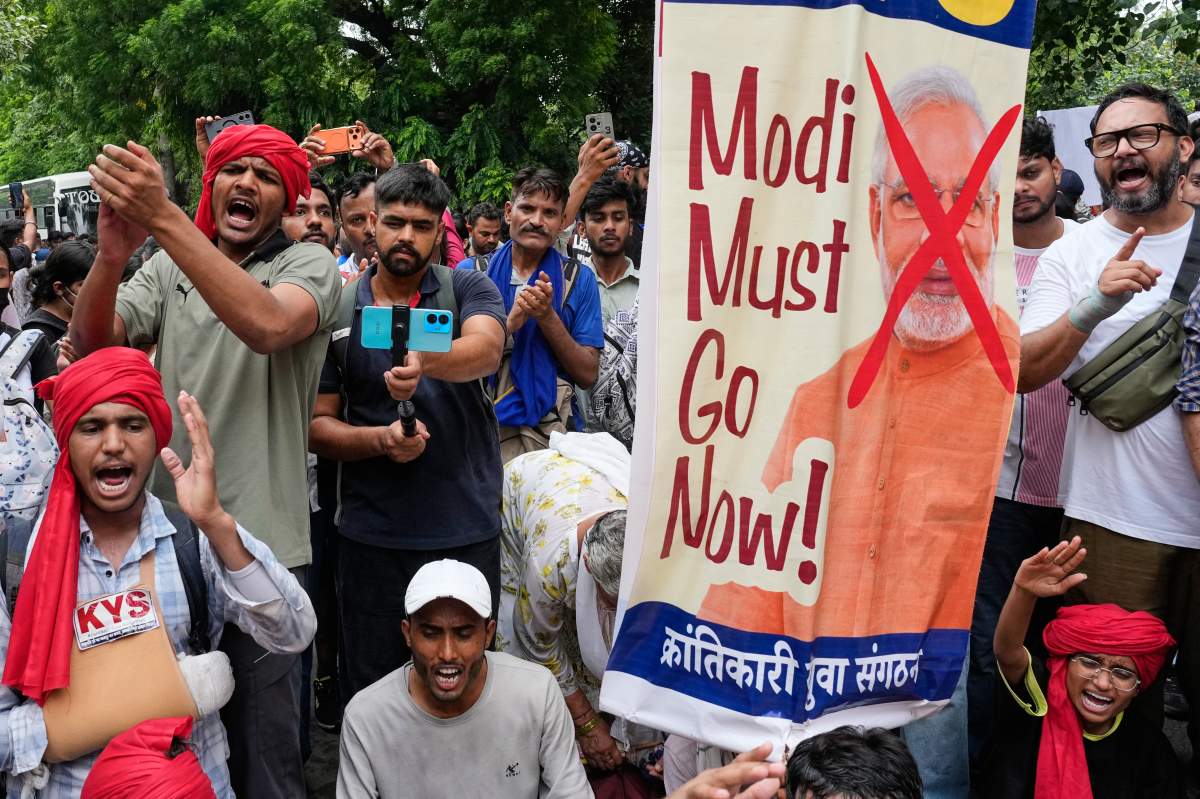 Supporters of the Cockroach Janta Party anti government slogans as they they attempt to march toward India's Parliament, demanding the resignation of the education minister, in New Delhi, India, Monday, July 20, 2026. (AP Photo/Manish Swarup)