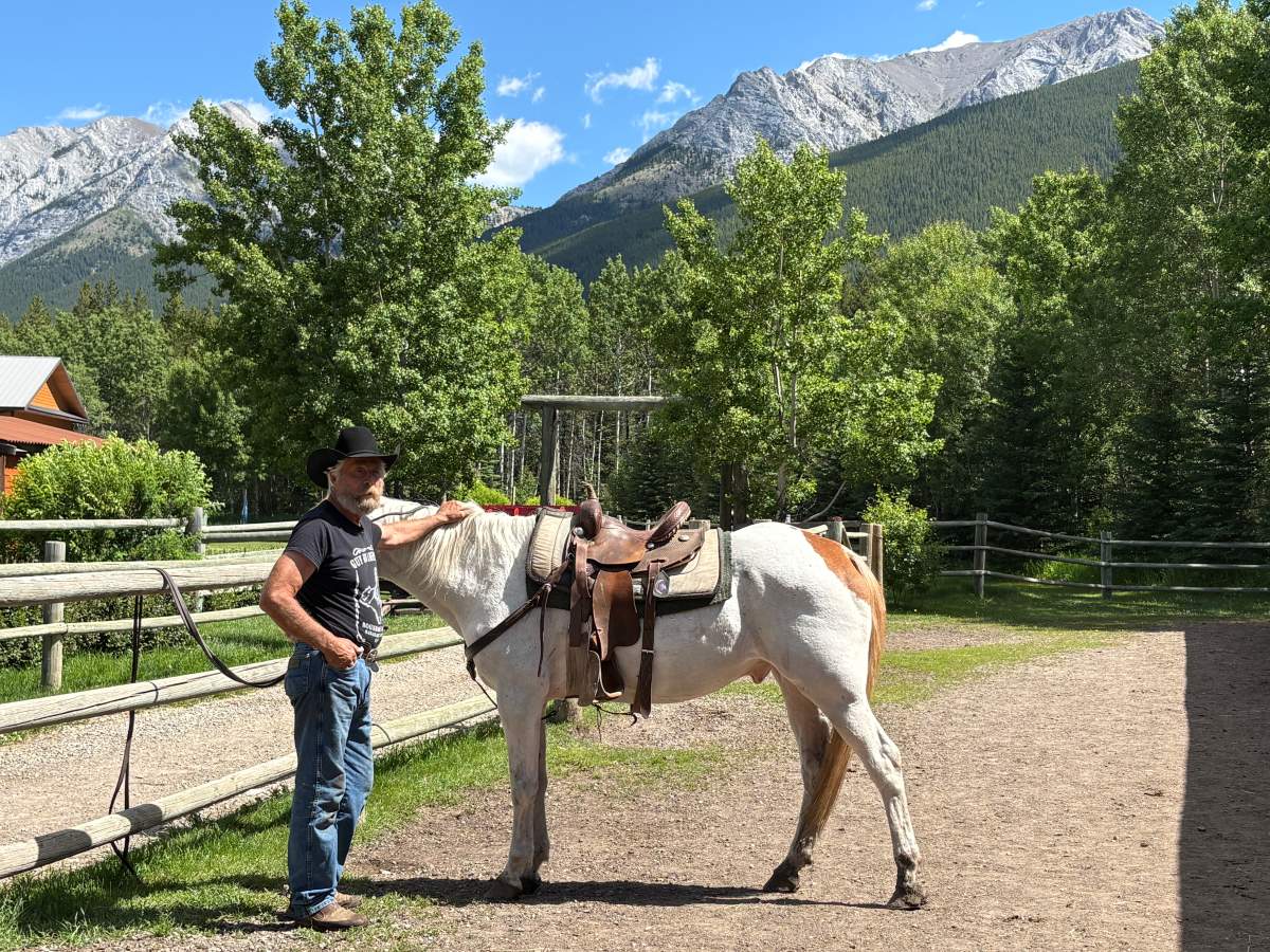 Rancher Rick Guinn with a horse at Boundary Ranch.