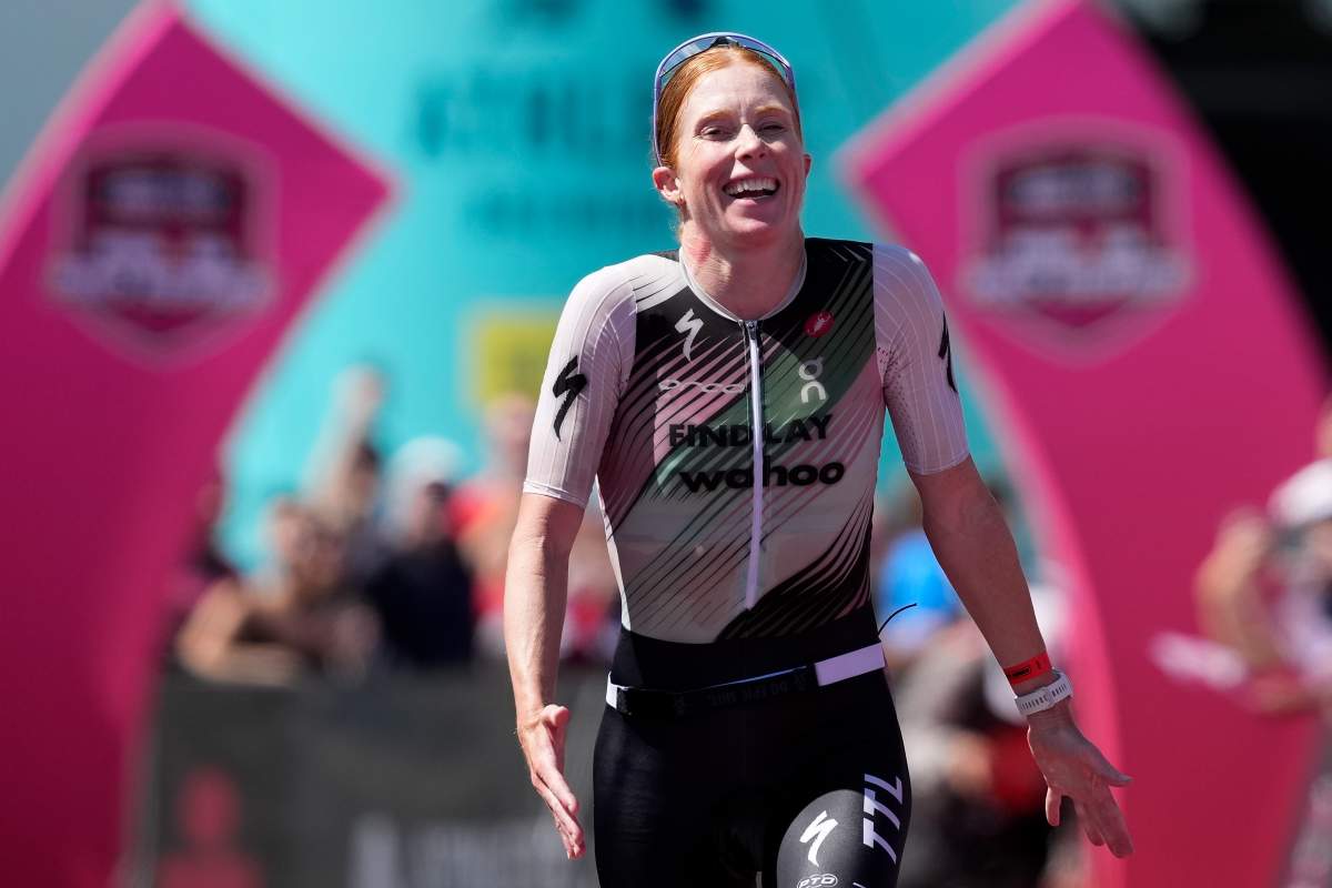 Paula Findlay celebrates as she crosses the finish line in first place to win the Women’s Professional division of the 2026 Athletic Brewing IRONMAN Lake Placid on July 19, 2026 in Lake Placid, New York.