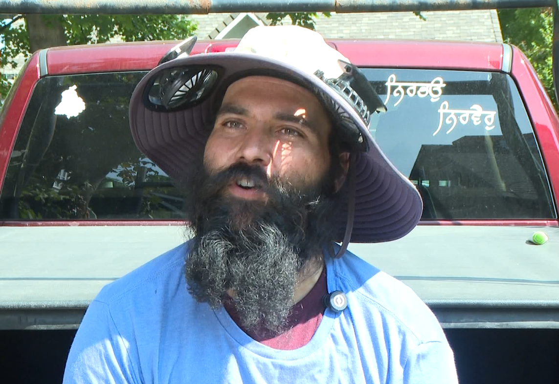 Simranpreet Singh, Supervisor roofer, Pinnacle Roofing. Talks with us during a hot day in Kelwona