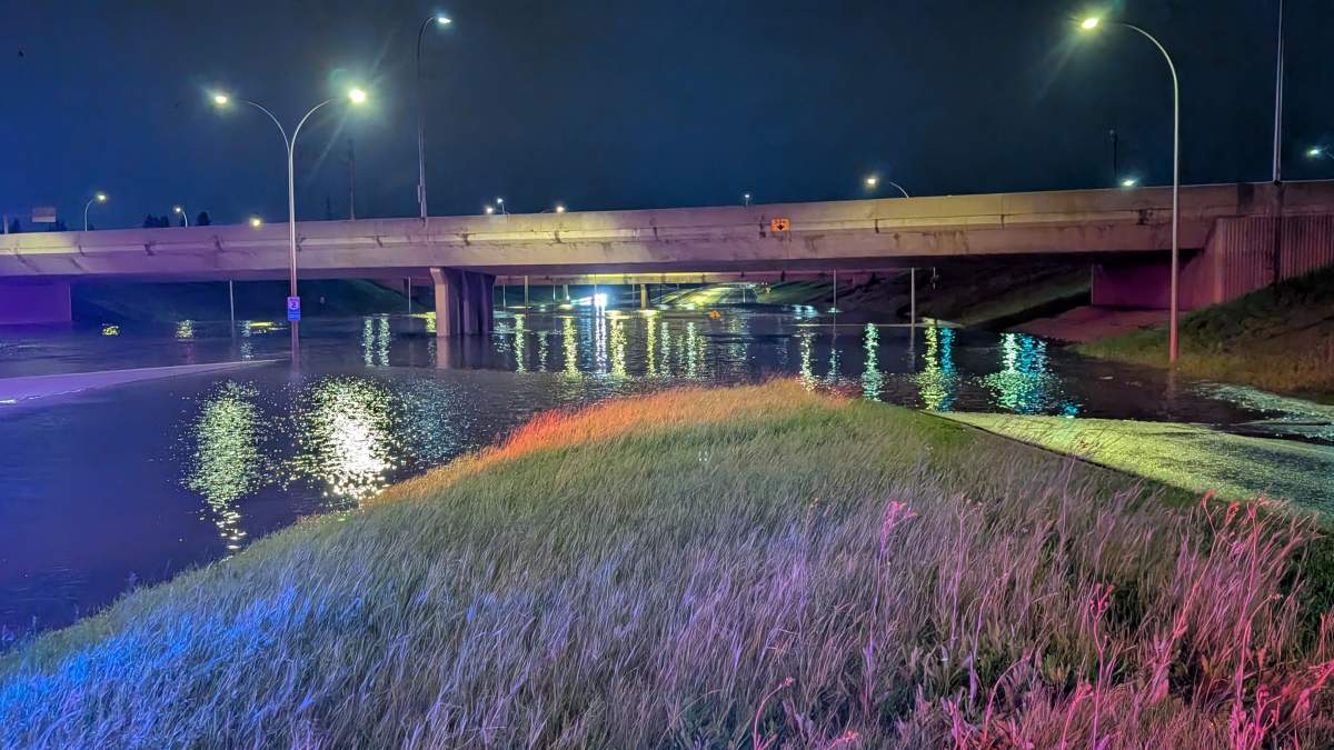 Whitemud Drive flooded under the 170 Street overpass in west Edmonton on Saturday, July 26, 2026.