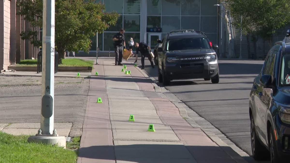 Police evidence markers lined a section of sidewalk, near 16 Street and 12 Avenue Southwest as police investigated an early Tuesday morning assault.