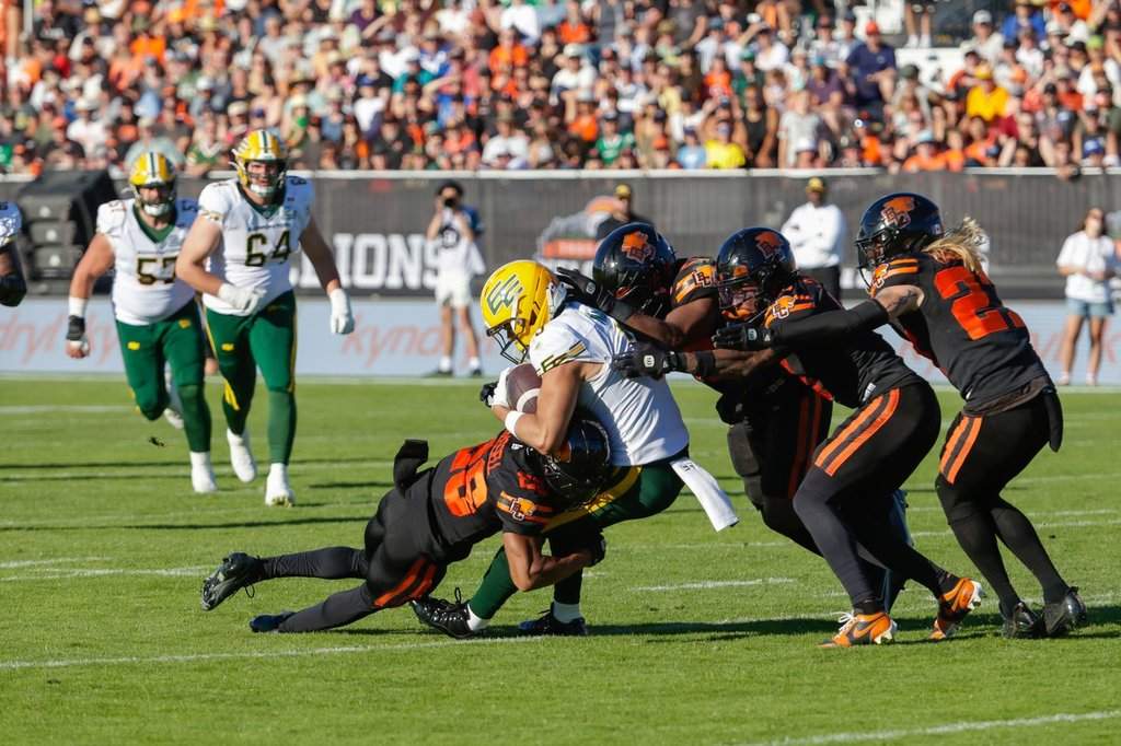 Edmonton Elks' Austin Mack (3) is swarmed by the B.C, Lions defence during second half CFL football action in Kelowna, B.C., on Saturday July 4, 2026. THE CANADIAN PRESS/Steve Dunsmoor.
