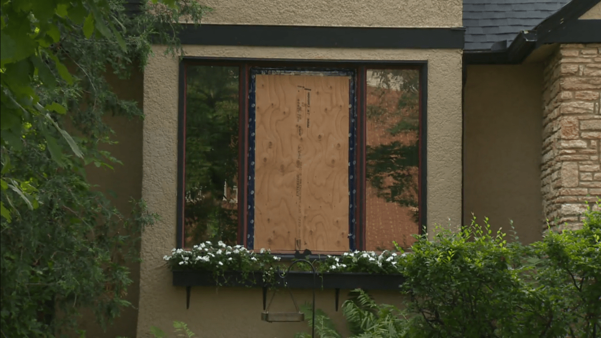 A window is boarded up after being one of several broken as part of a string of break-ins in Winnipeg on July 25.