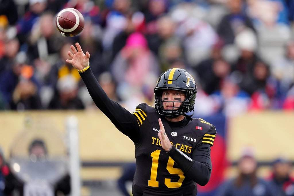 Hamilton Tiger-Cats quarterback Jake Dolegala (15) throws a pass during first half CFL eastern final football action against the Montreal Alouettes, in Hamilton, Ont., Saturday, Nov. 8, 2025. THE CANADIAN PRESS/Frank Gunn.
