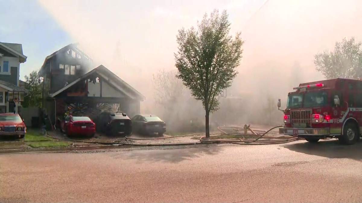 Fire damaged several homes on Cameron Ravine Way in southwest Edmonton's Cameron Heights neighbourhood on Tuesday, July 14, 2026.