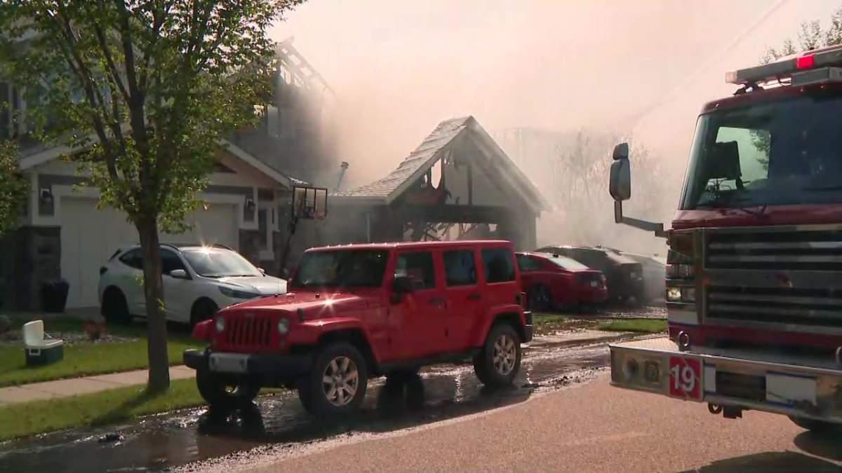 Fire damaged several homes on Cameron Ravine Way in southwest Edmonton's Cameron Heights neighbourhood on Tuesday, July 14, 2026.