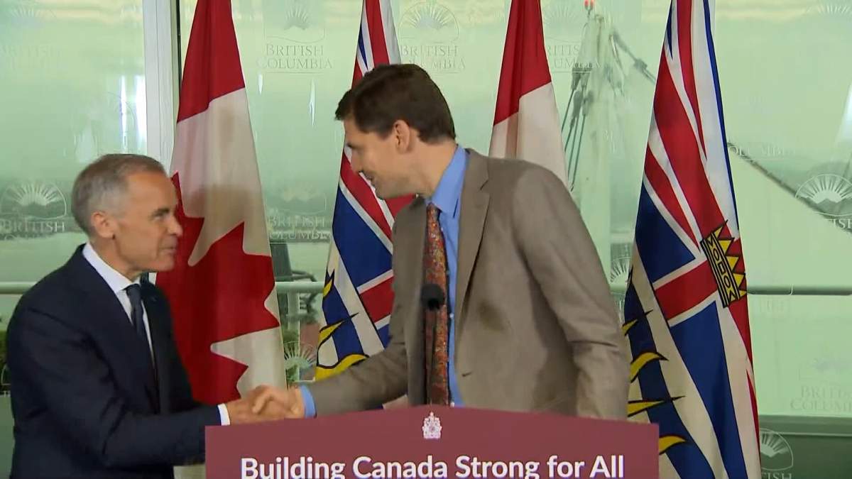 Prime Minister Mark Carney and British Columbia Premier David Eby shake hands following a joint press conference in Vancouver on Thursday.