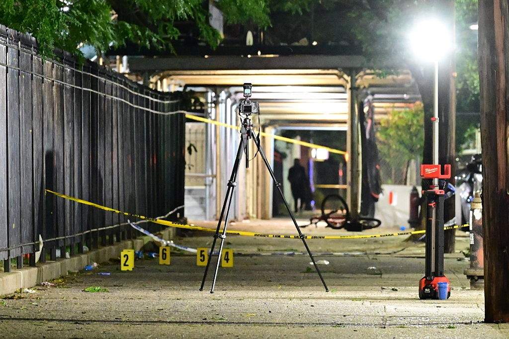 NYPD Crime Scene Unit collected evidence, marked shell casings with evidence markers and worked at the scene after eight people, including four children, were shot in a mass shooting near the intersection of West 30th Street and Surf Avenue in the Coney Island neighborhood of Brooklyn, New York, United States, on July 4, 2026.
